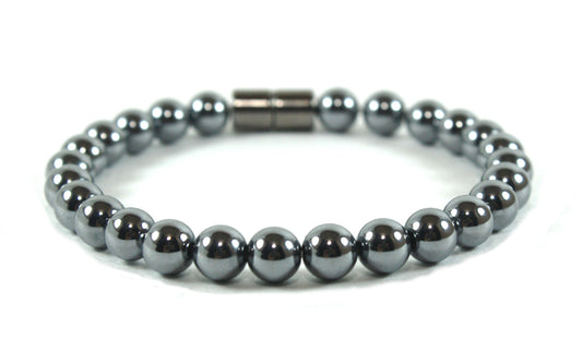 A photorealistic close-up of a handcrafted crystal bracelet lying on a wooden surface, soft natural light highlighting t