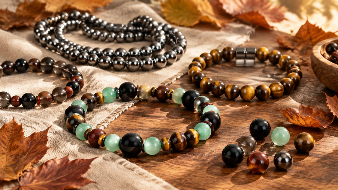 Grounding gemstone bracelets and beads resting on a warm natural surface in soft autumn light