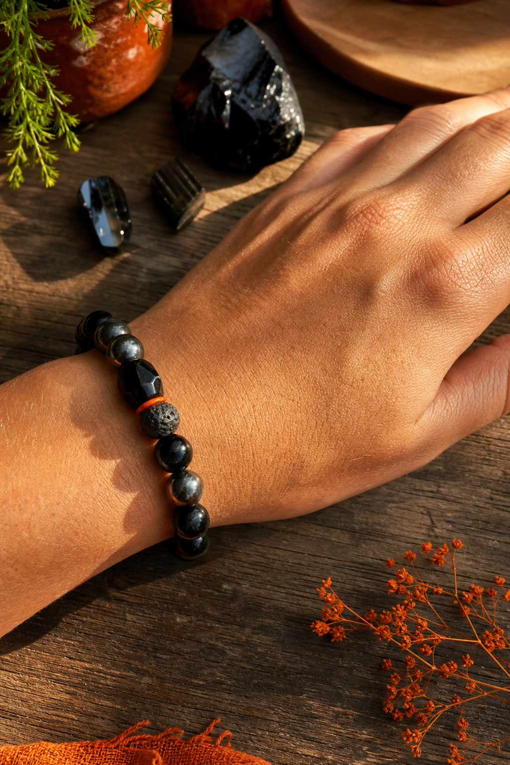 Auras of Osiris triple protection crystal bracelet on a hand