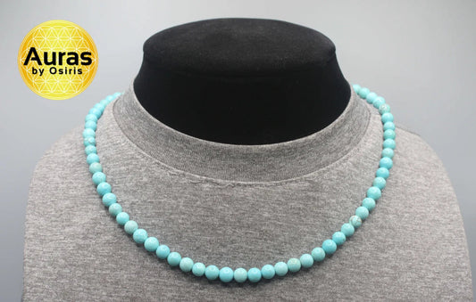 Handmade sky-blue turquoise bead necklace displayed against a soft neutral background