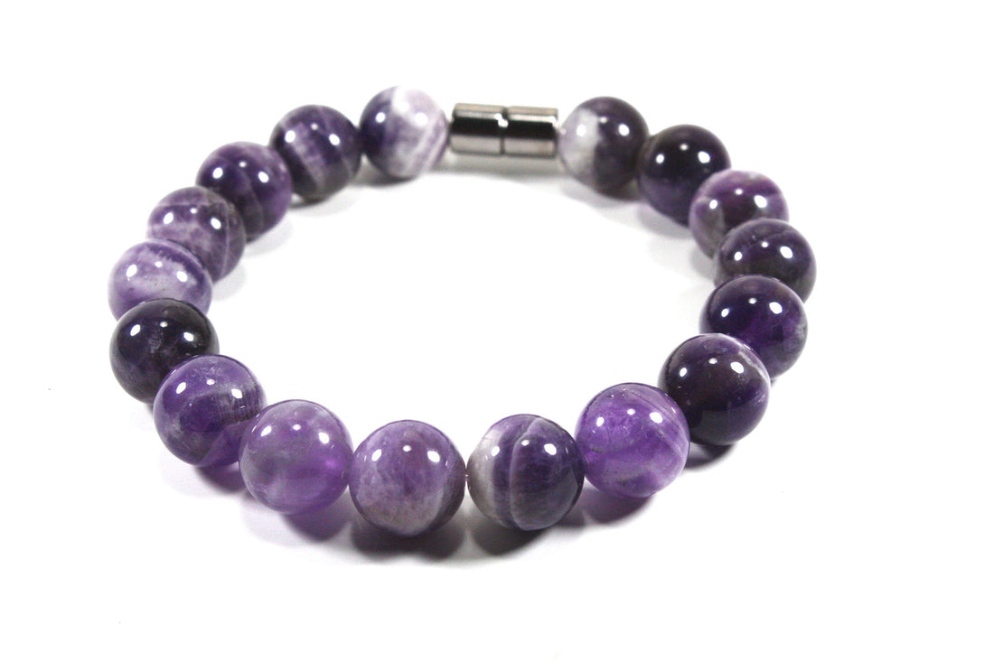 Handmade 12mm natural amethyst bracelet with purple and white banding and a magnetic clasp